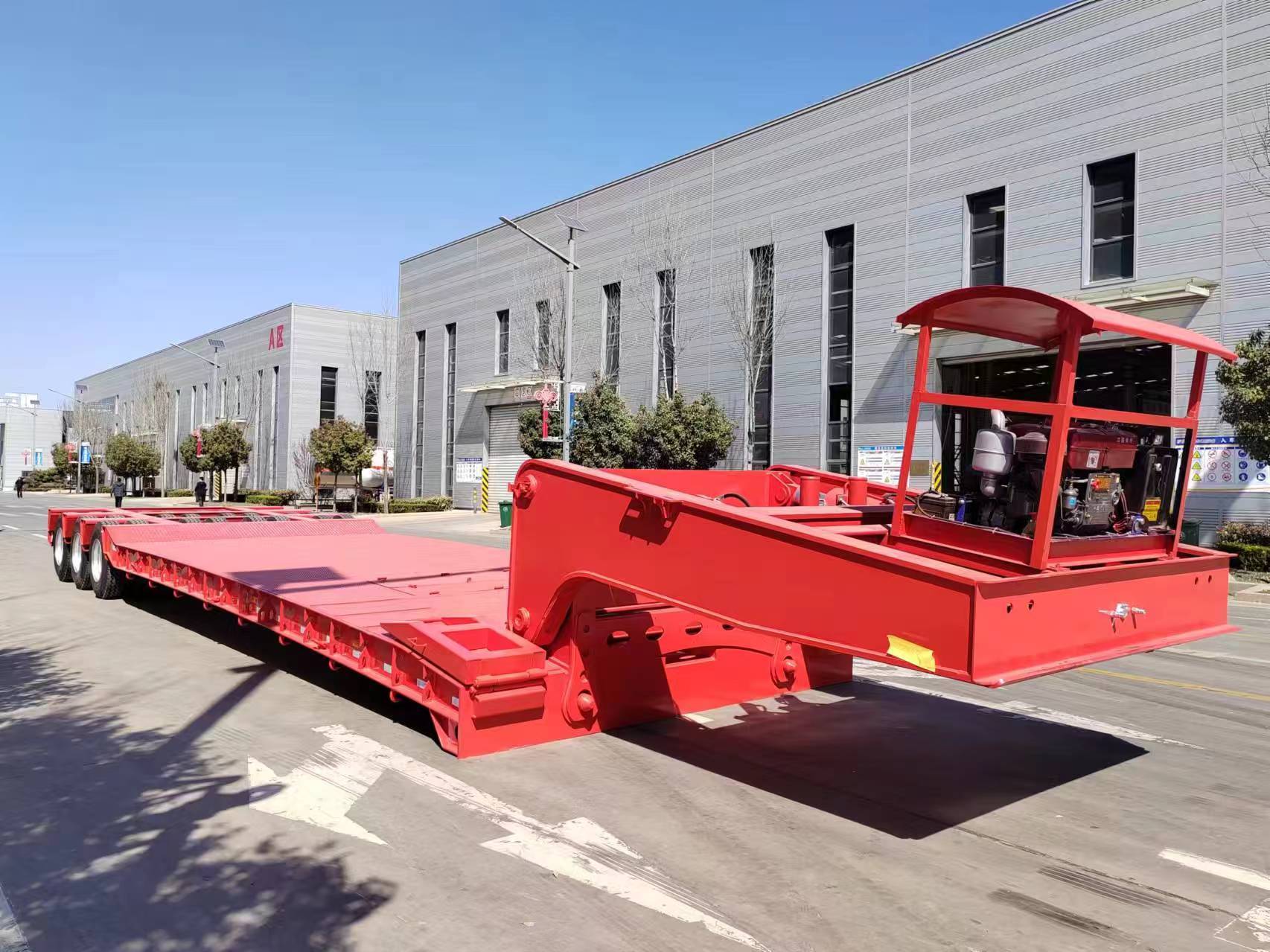Multi-axle heavy haul lowbed trailer rated for 100 tons with hydraulic self-steering bogie